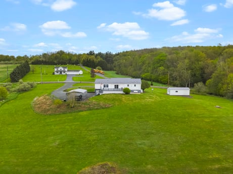 An image featuring sky, cloud, plant, natural landscape, tree, land lot, house, slope, plain, grass at 993 Dieffenbach Rd.