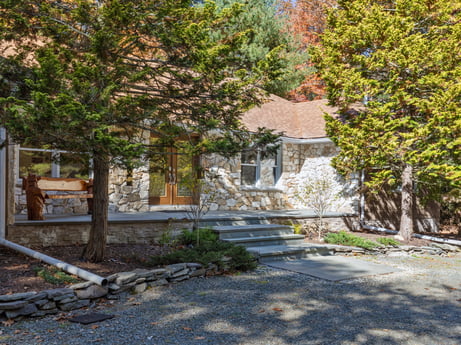 An image featuring plant, window, branch, building, road surface, tree, shade, stairs, woody plant, grass at 125 Rimstone Ct.