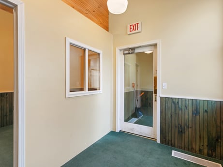 An image featuring fixture, paint, wood, interior design, hall, floor, flooring, real estate, ceiling, glass at 213 Main St.
