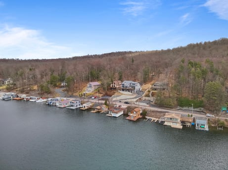 An image featuring water, cloud, sky, tree, lake, natural landscape, watercourse, coastal and oceanic landforms, bank, landscape at 815 Lakeside Dr.