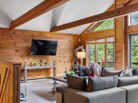 An image featuring furniture, property, window, wood, couch, interior design, living room, beam, wood stain, floor at 125 Marcy Rd.