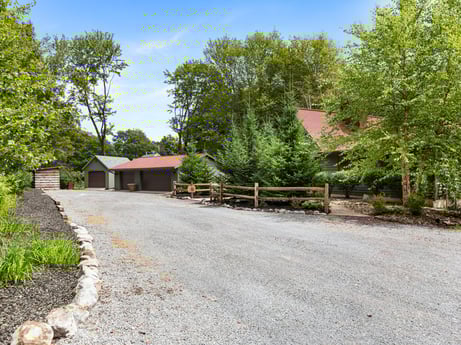 An image featuring sky, plant, tree, road surface, natural landscape, land lot, building, asphalt, real estate, rural area at 276 Mountain View Ln.