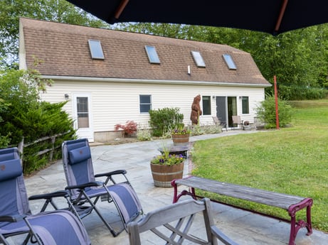 An image featuring plant, building, property, window, furniture, outdoor bench, outdoor furniture, house, chair, cottage at 130 Haighs Pond Rd.