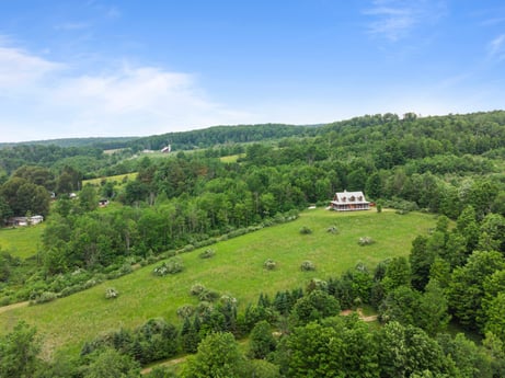 An image featuring cloud, plant, sky, green, tree, natural landscape, highland, mountainous landforms, cumulus, plain at 1761 Brick House Rd.