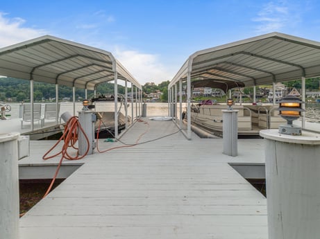 An image featuring sky, cloud, shade, wood, roof, urban design, leisure, city, boat, facade at 218 Point Rd.