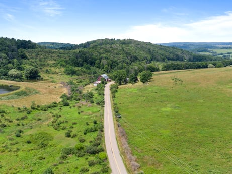 An image featuring cloud, sky, plant, natural landscape, mountain, tree, grassland, grass, mountainous landforms, slope at 1863 Sopertown Rd.