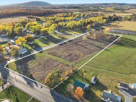 An image featuring plant, property, building, land lot, sky, tree, natural landscape, urban design, grass, slope at Elm Dr.