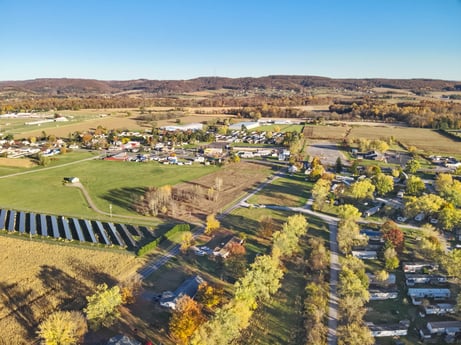 An image featuring sky, plant, natural landscape, tree, highland, land lot, grass, residential area, plain, grassland at Elm Dr.