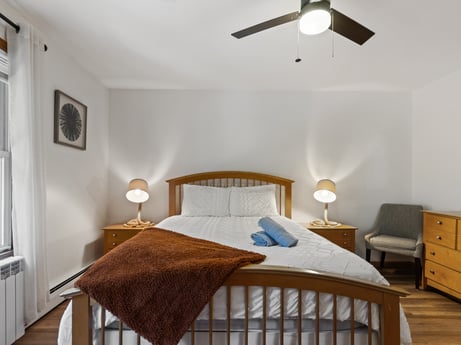 An image featuring furniture, property, comfort, wood, building, ceiling fan, lighting, interior design, floor, bed at 125 Rimstone Ct.