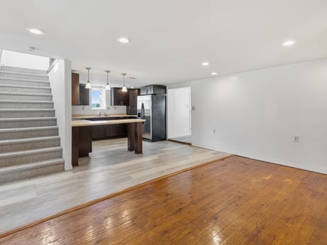 An image featuring wood, interior design, hall, flooring, floor, wood stain, fixture, laminate flooring, building, hardwood at 5442 Clarkstown Rd.