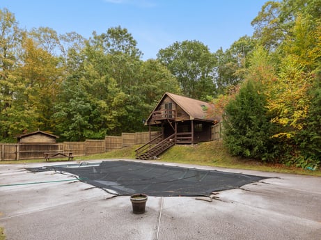An image featuring sky, plant, shade, land lot, road surface, asphalt, tree, wood, cottage, natural landscape at 121 Marcy Rd.