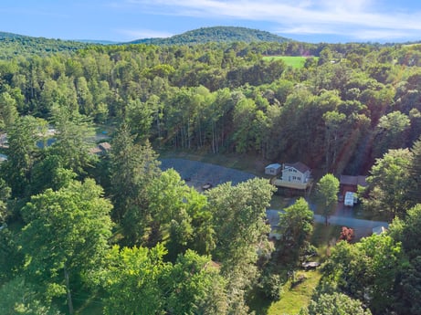 An image featuring cloud, water, sky, tree, natural landscape, plant, highland, lake, larch, bank at 127 Shore Dr.