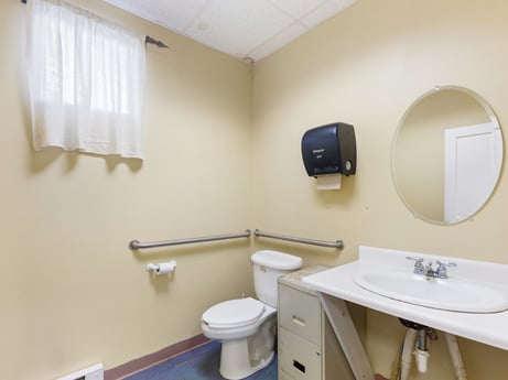 An image featuring mirror, bathroom sink, sink, plumbing fixture, toilet seat, tap, bathroom, purple, toilet, architecture at 213 Main St.