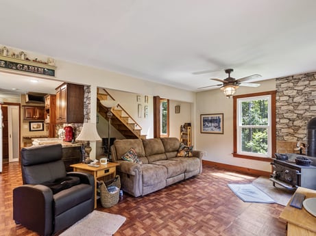 An image featuring picture frame, furniture, table, couch, houseplant, interior design, living room, lighting, wood, flooring at 145 Nichols Ln.