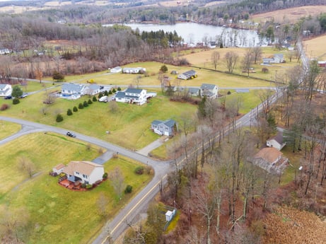 An image featuring plant, property, ecoregion, tree, land lot, car, grass, motor vehicle, natural landscape, vehicle at 18 Country View Dr.