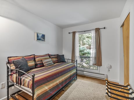 An image featuring property, window, comfort, wood, couch, shade, building, interior design, flooring, floor at 104 Stony Mountain Rd.