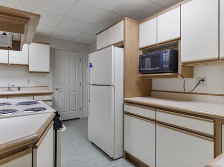 A kitchen at 218 Point Rd featuring: cabinetry, property, furniture, building, interior design, flooring, floor, kitchen, wood, major appliance