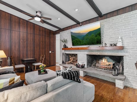 An image featuring property, couch, interior design, lighting, orange, wood, living room, table, floor, wall at 104 Stony Mountain Rd.