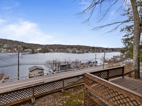 An image featuring sky, water, cloud, tree, wood, plant, lake, bank, landscape, horizon at 815 Lakeside Dr.