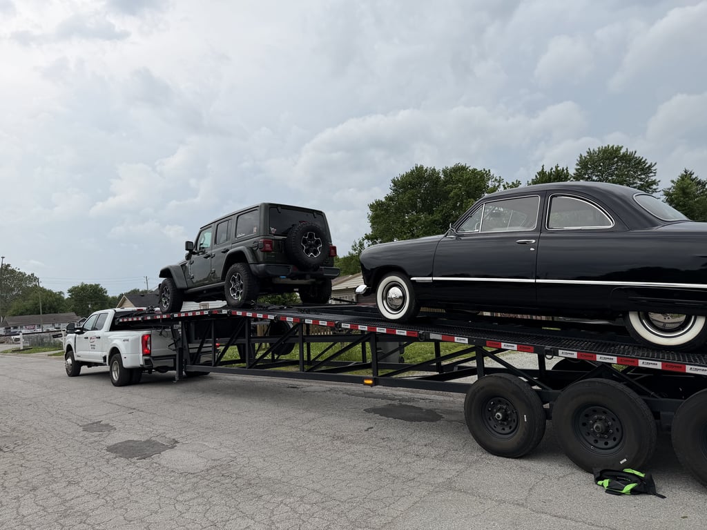 Velocity Logistics wedge carrier loaded with a Jeep and a classic car
