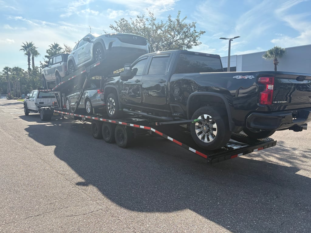 Fully loaded Velocity Logistics Texas Pride car hauler on a Sun Belt delivery
