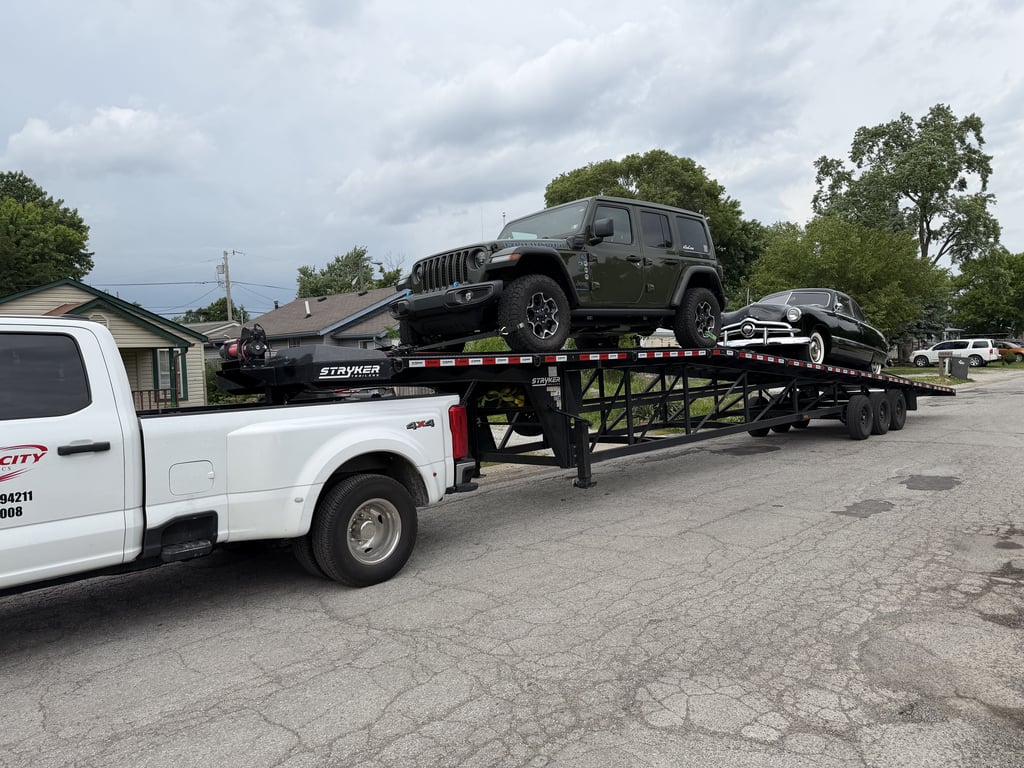 Velocity Logistics carrier loaded with cars on the road