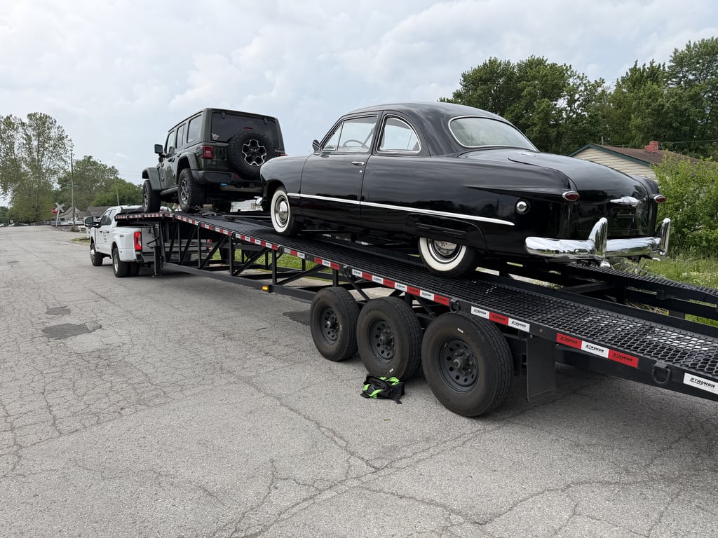 Velocity Logistics 3-car wedge carrier loaded with vehicles