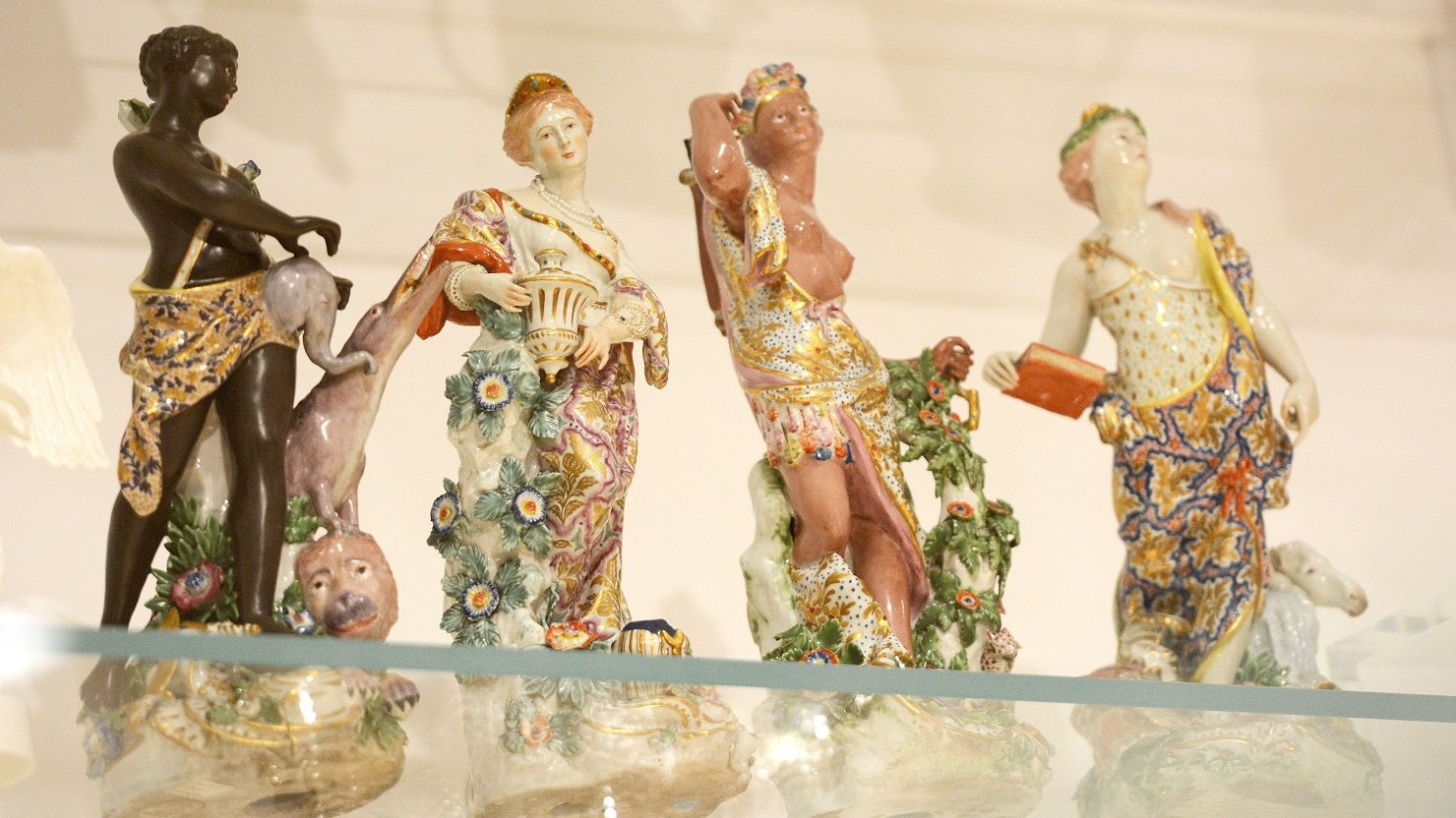 The 'Four Continents' ceramic figurines on display in The Box's art gallery