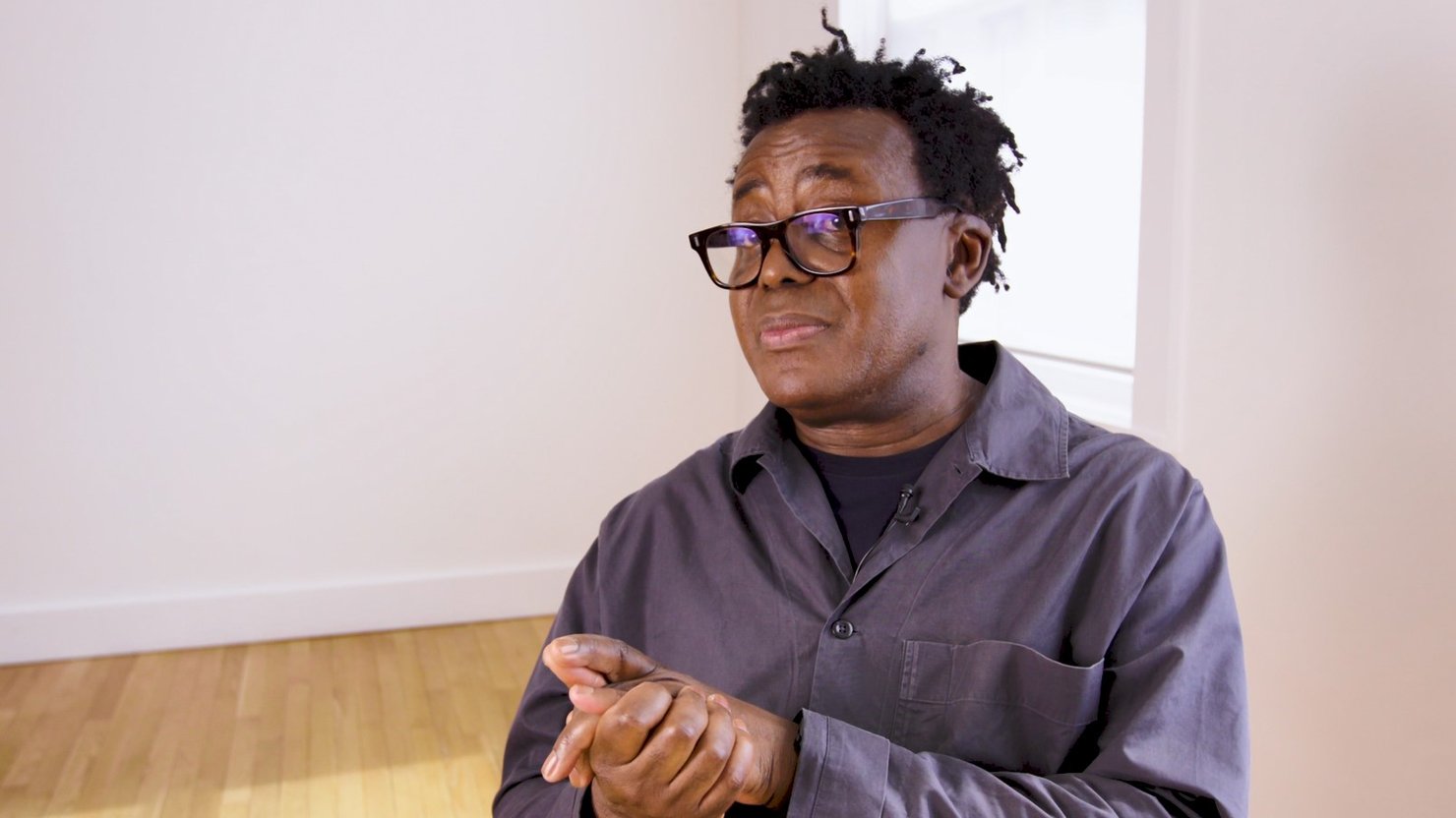 John Akomfrah: in the process of [doing something]