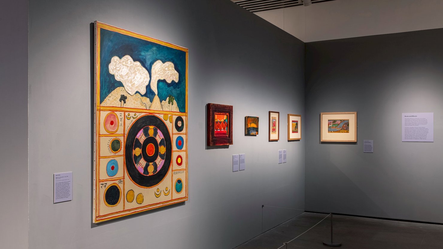 A photograph showing a large contemporary artwork alongside several smaller ones.