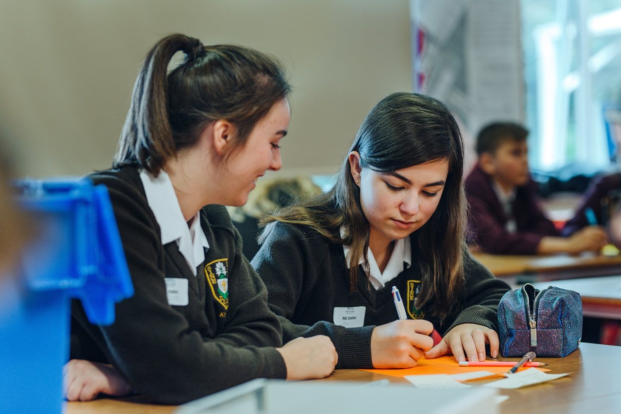 School girls taking part in a workshop in their classroom