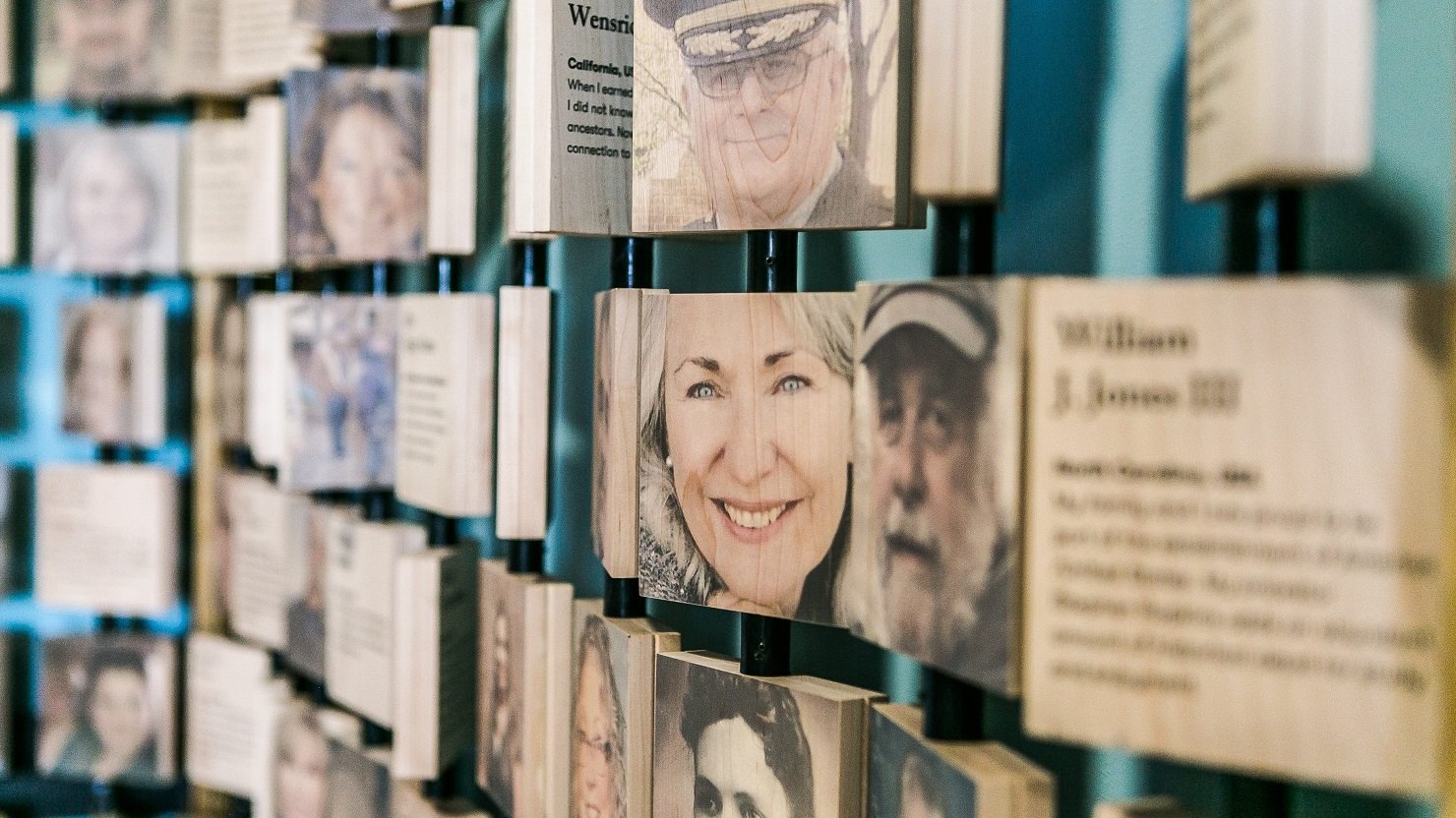 Wall of faces at the Mayflower Museum in Plymouth