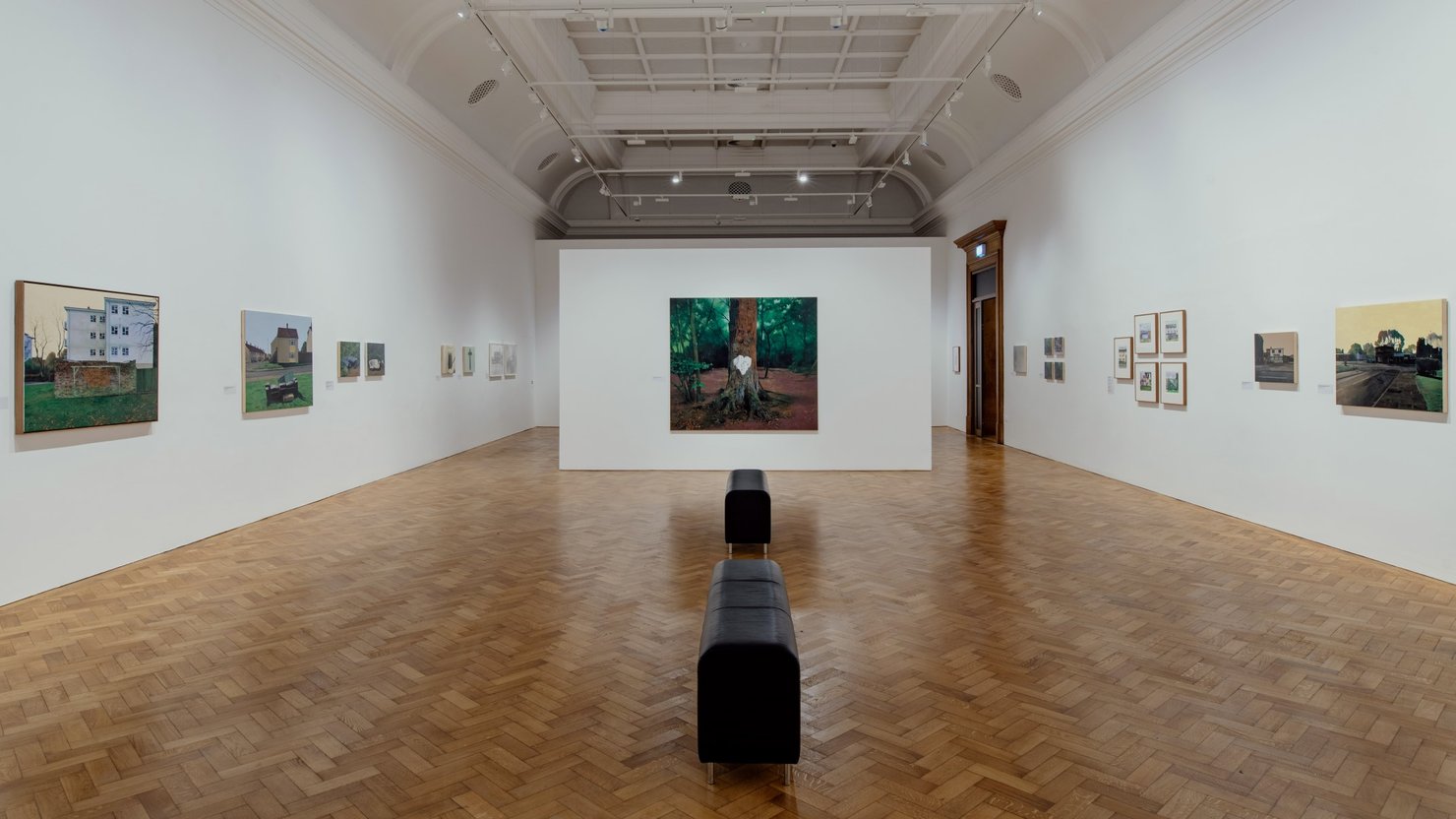 George Shaw's artwork in gallery with painting in central focus and others on walls either side