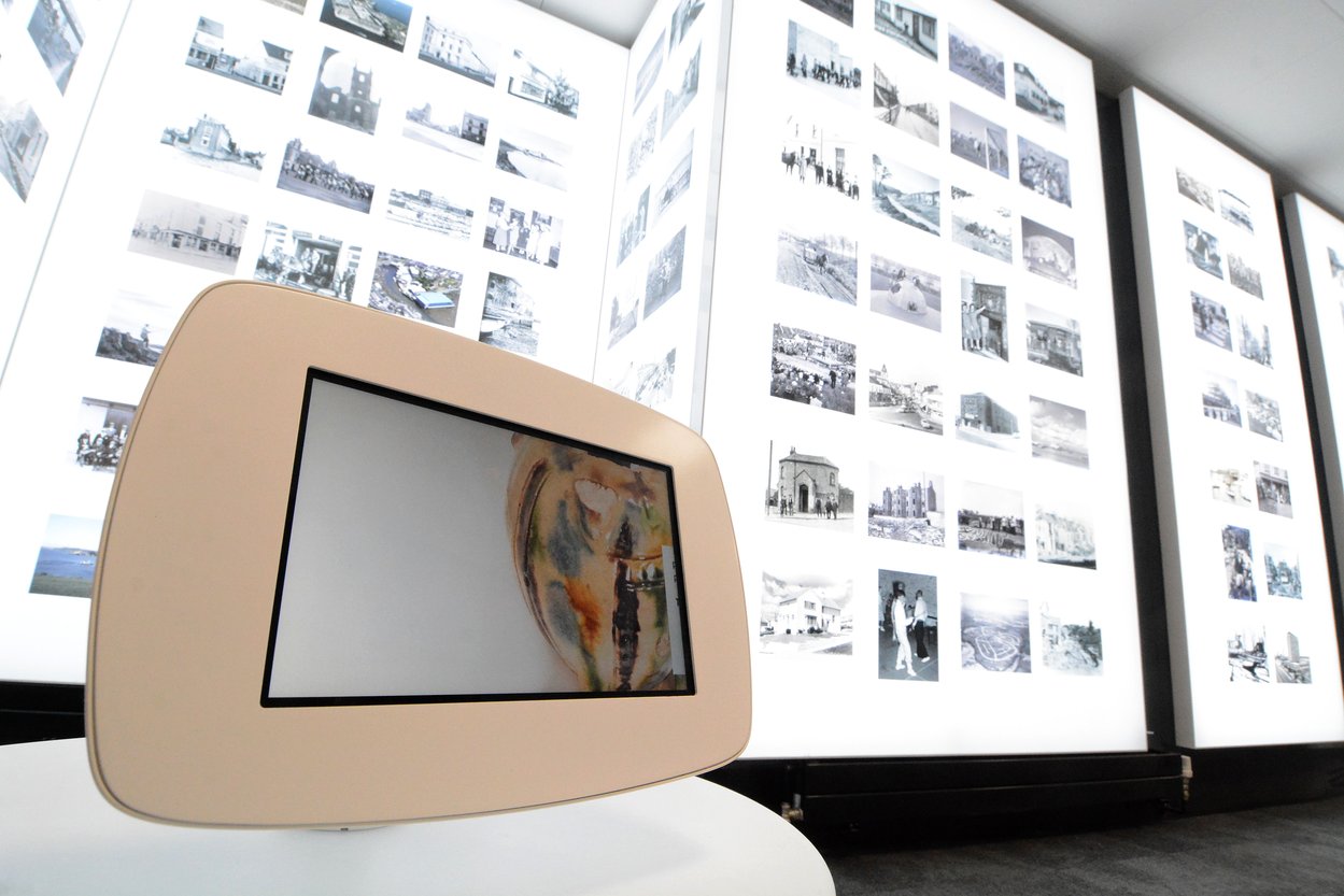 An image of the 'Photo Album' gallery at The Box, Plymouth with images on giant lightboards