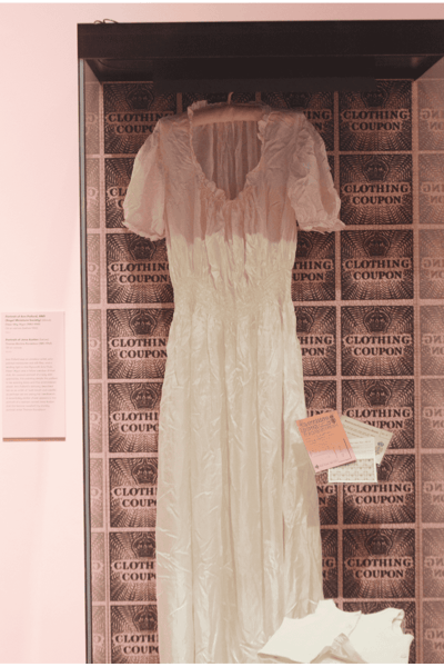 Parachute nightdress in a display case with smaller items in Dress Code exhibition (2022).