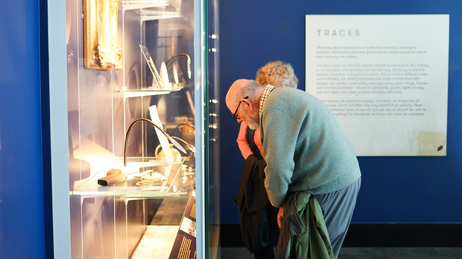 Two people look at the Devonport 200 displays in the Bridge gallery
