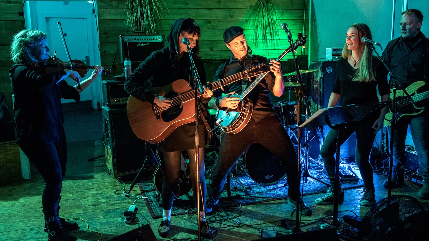 Image of a band playing guitars