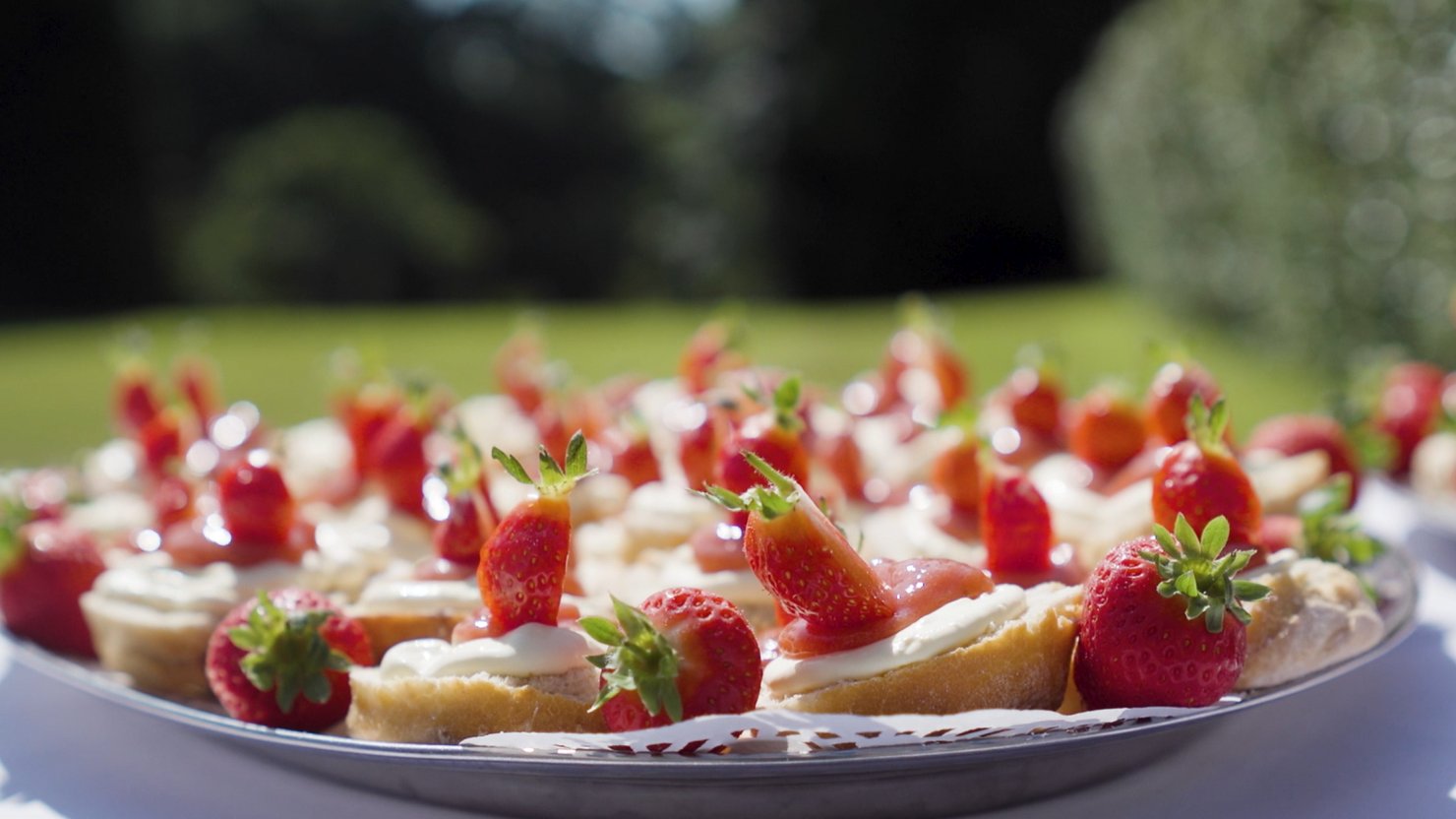A plate of scones and strawberries
