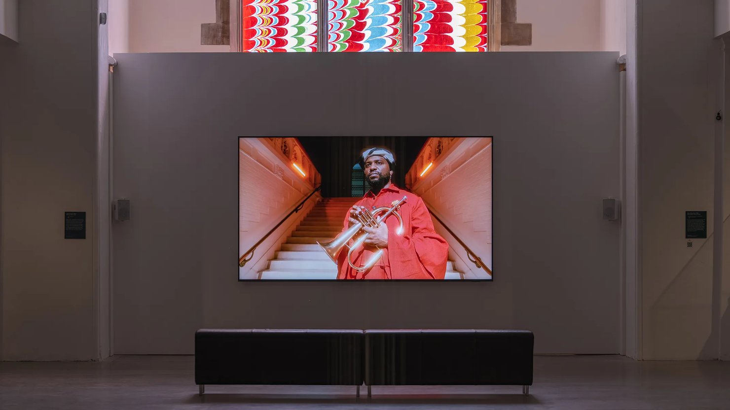 Photograph showing a film work on display in a gallery