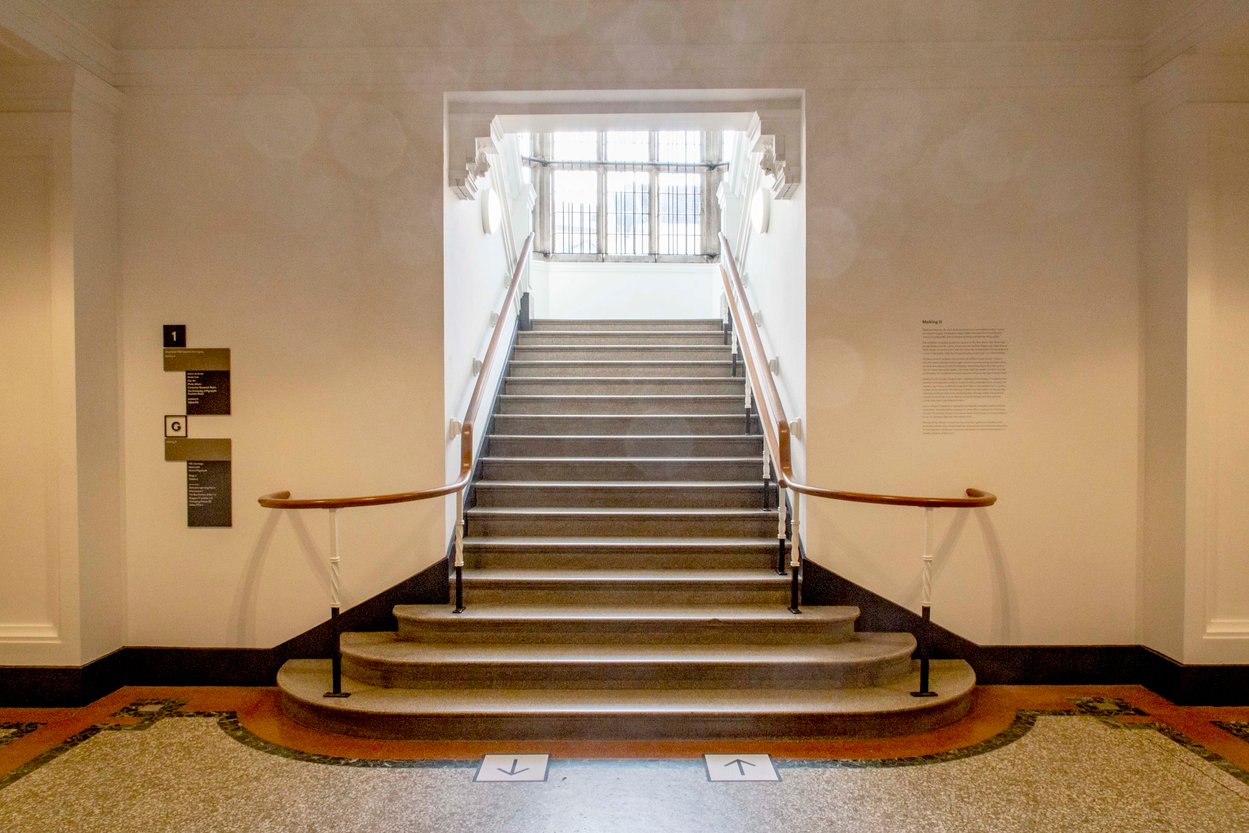 Photograph showing stairs leading into a foyer