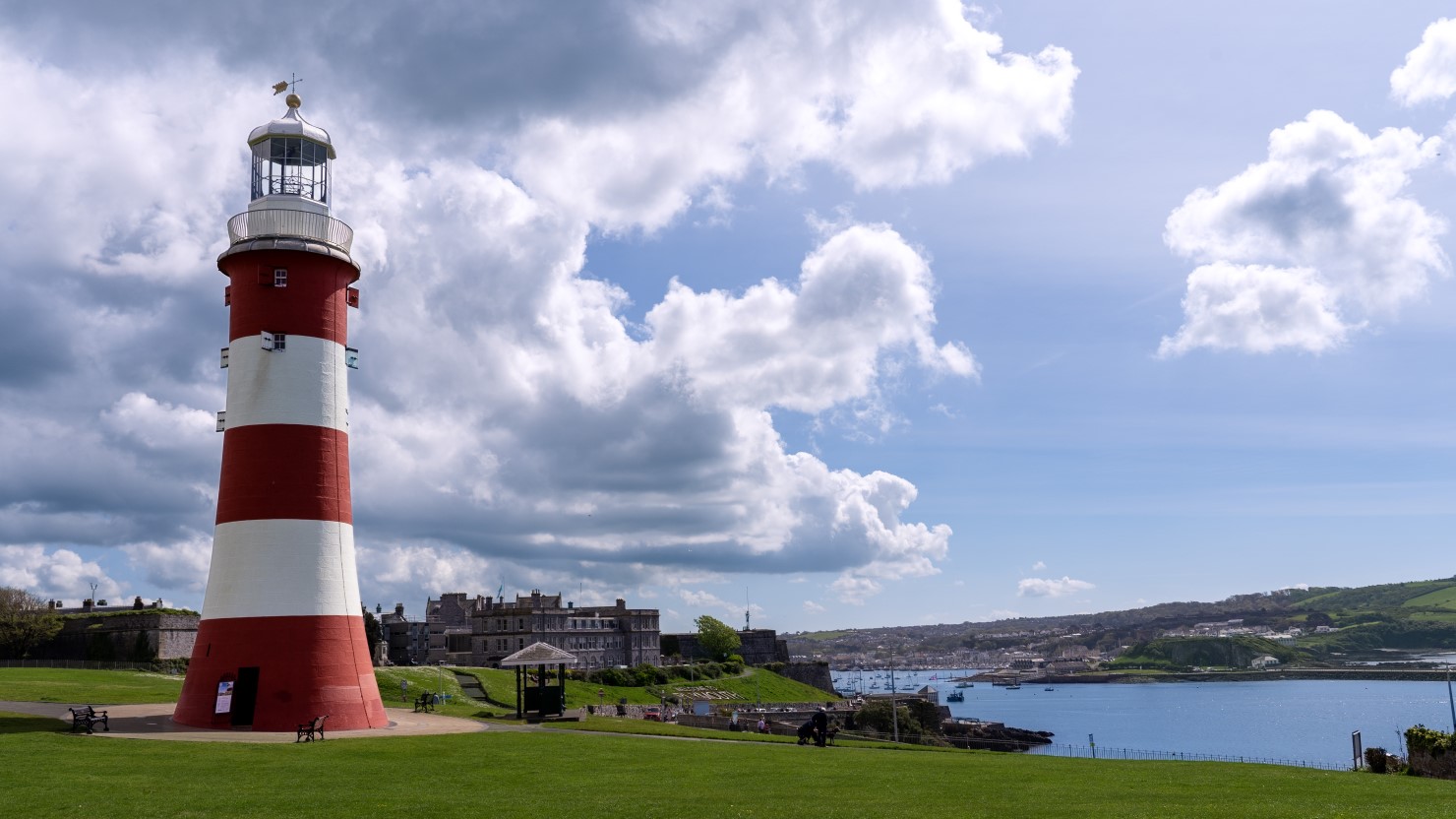 A photograph Smeaton's Tower - a red and white striped lighthouse on Plymouth Hoe