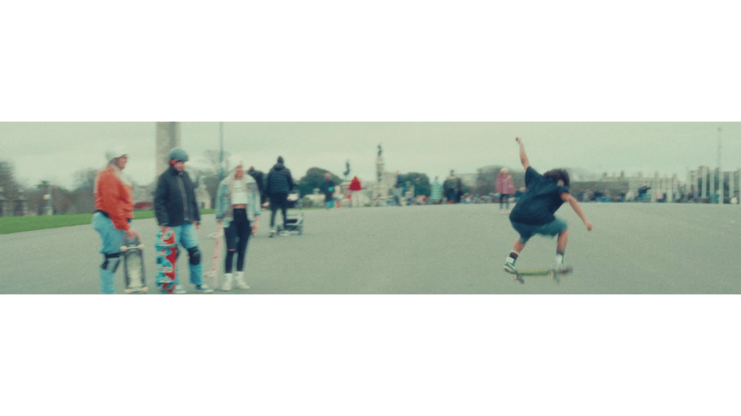 Still from a colour film showing skateboarders on Plymouth Hoe