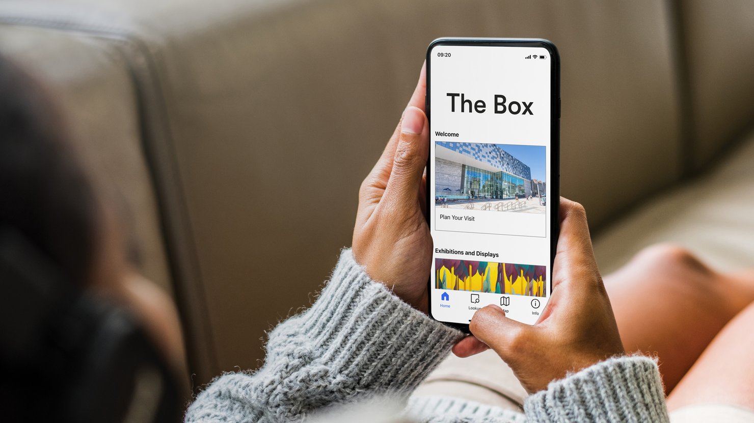 A woman looking at the Bloomberg Connects guide on her mobile phone