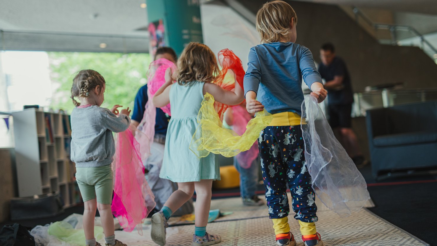 A group of children take part in a Tiny Tales session at Theatre Royal Plymouth. Image by Dom Moore.