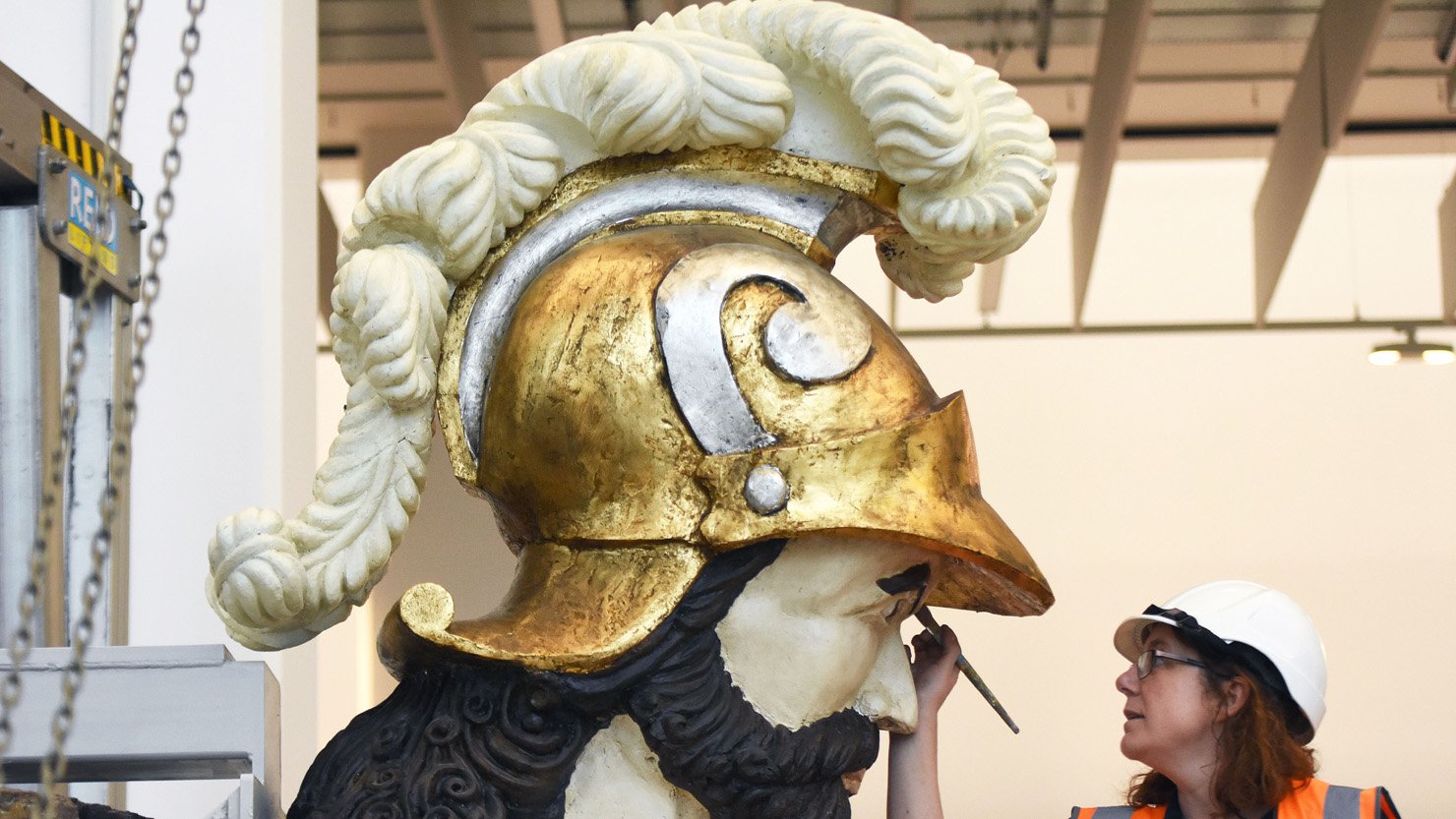 The Defiance figurehead undergoing conservation work