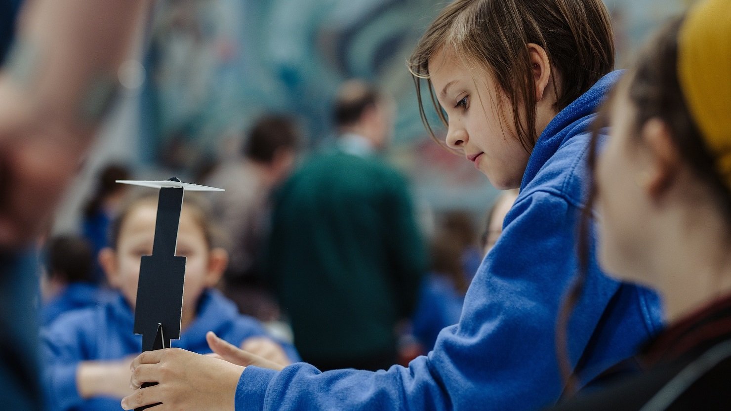 A female school pupil takes part in a design experiment