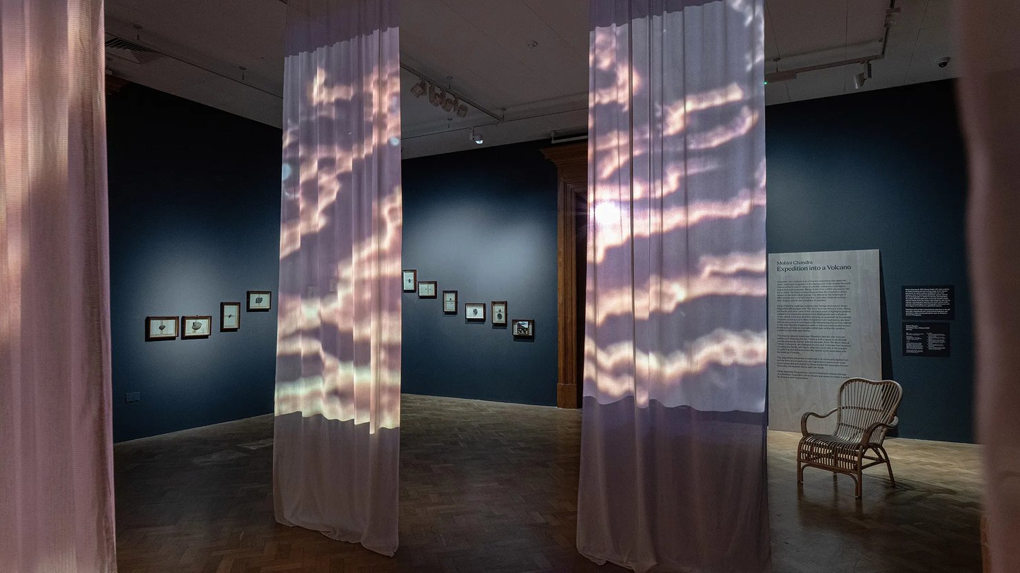 Photograph showing a film installation projected onto drapes