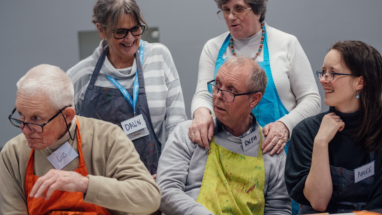 Photograph showing a group of people of mixed ages in a workshop