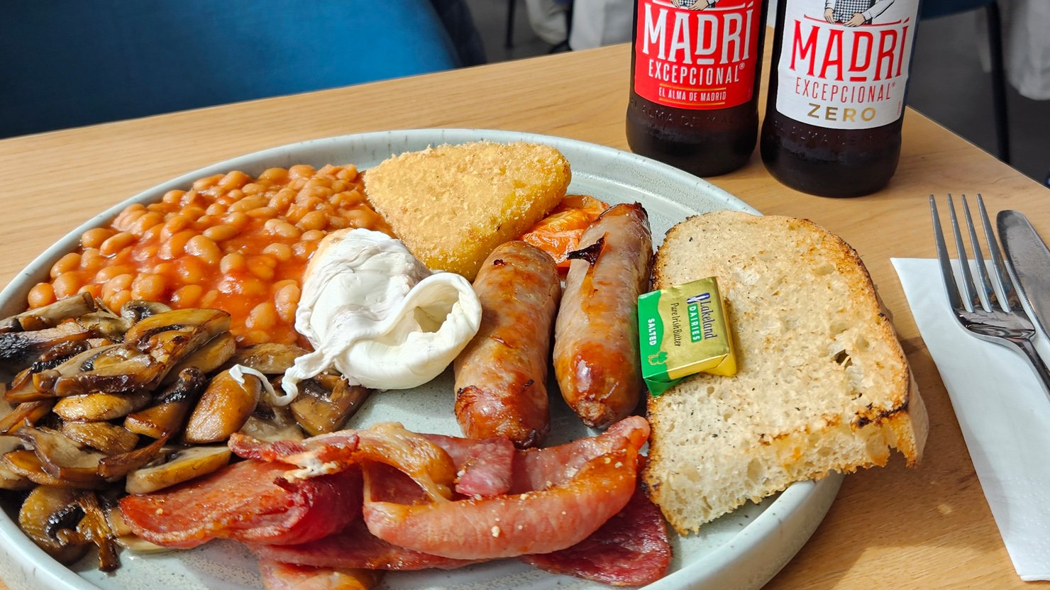 A Box Breakfast on a table with bottles of Madri and Madri Zero