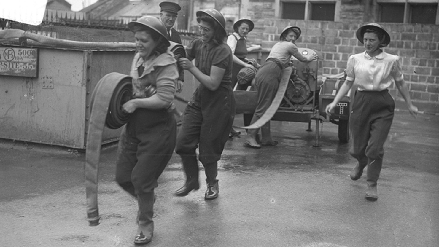 Members of the Women’s Auxiliary Fire Service in action during WWII. Courtesy of The Box, Plymouth